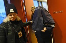 The woman arriving with a covered face at court today.
