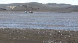 The vehicles, stuck in the stream.