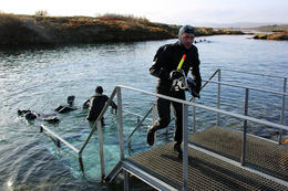 Divers in Silfra fissure.