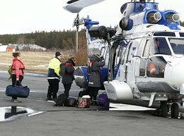 Health care workers, boarding the Icelandic Coast Guard helicopter.
