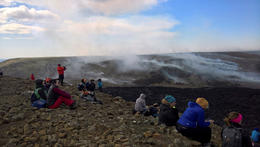 From the eruption site. The smoke in the distance is from wildfires.