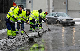 City workers unblocking the drains.