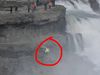 NEVER DO THIS: A tourist risking her life at the powerful Gullfoss falls in South Iceland.