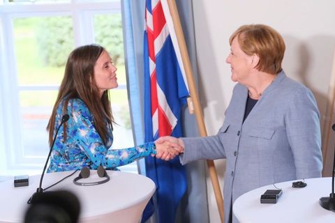 Prime Minister Katrín Jakobsdóttir and German Chancellor Angela Merkel shake hands.
