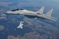 Vopnakerfi Pólskar orrustuþotur af gerðinni MiG-29 sjást hér leika sér í háloftunum. Pólverjar munu brátt senda tugi slíkra véla til Úkraínu.